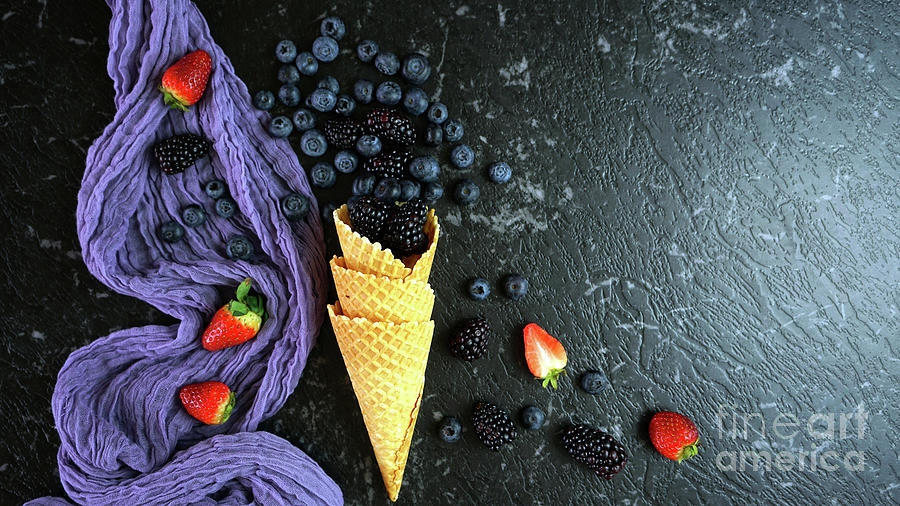 Summer blueberries and blackberries in ice cream waffle cone Photograph by Milleflore Images