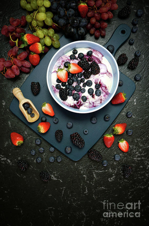Summer breakfast with yoghurt and berries creative flatlay top v Photograph by Milleflore Images