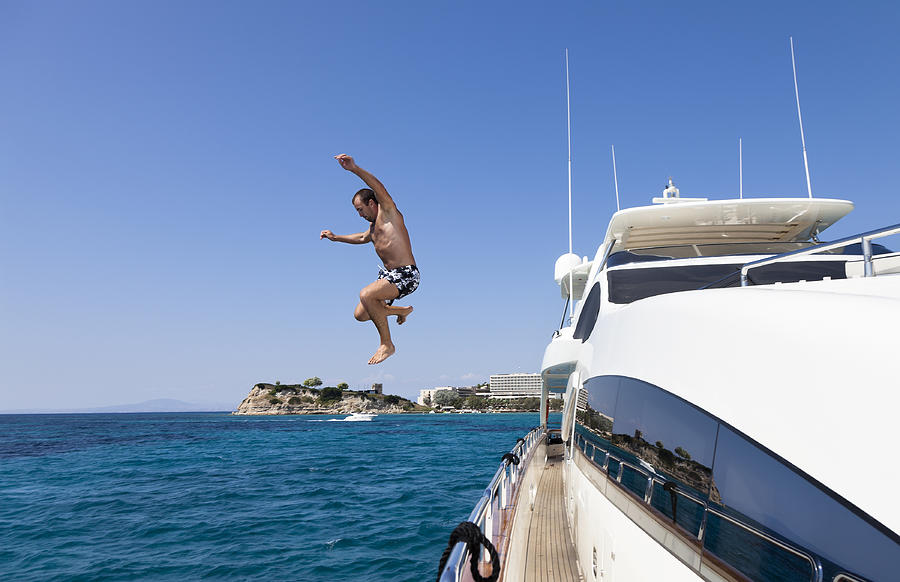 Summer Fun. Jumping from the Yacht into Ocean. Photograph by PetrePlesea
