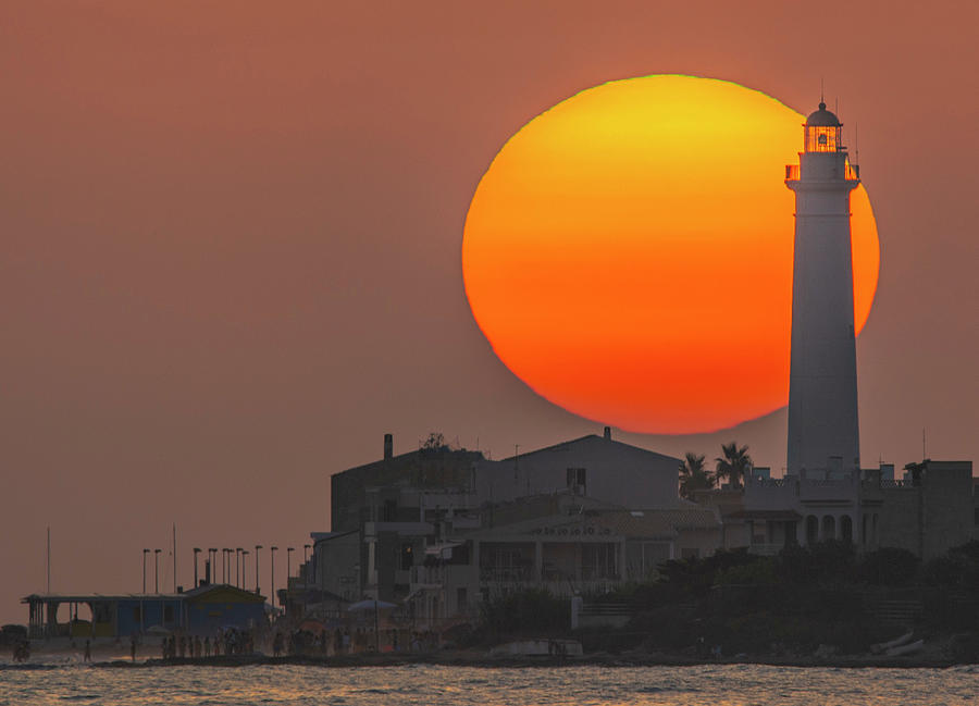 Sunset Photograph - Sun and Lighthouse by Marcella Giulia Pace