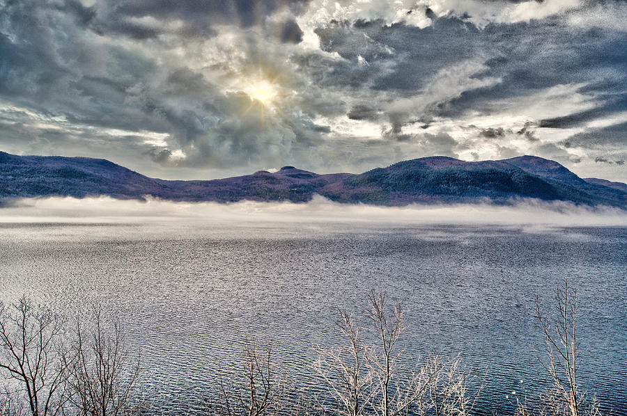 Sun and Storm Clouds over Lake Photograph by Russel Considine