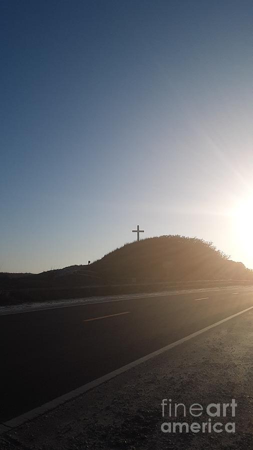 Sun beyond the cross  Photograph by Michelle Powell