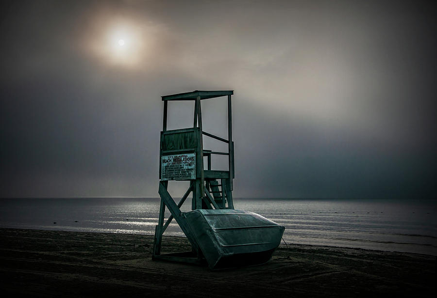 Sun burning away the morning fog by a Lifeguard Station Photograph by Randall Nyhof