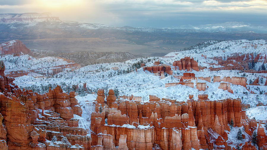 Sun Clouds Fog and Snow in Bryce Canyon Photograph by Alex Mironyuk