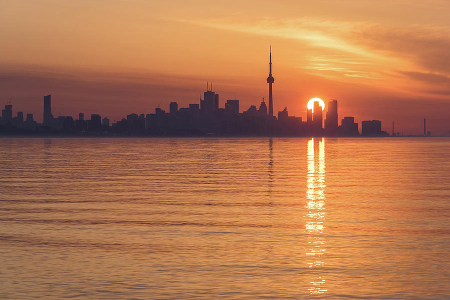 Sun Disk Carved by Skyscrapers - Toronto Skyline Sunrise in Orange and Purple Photograph by Georgia Mizuleva