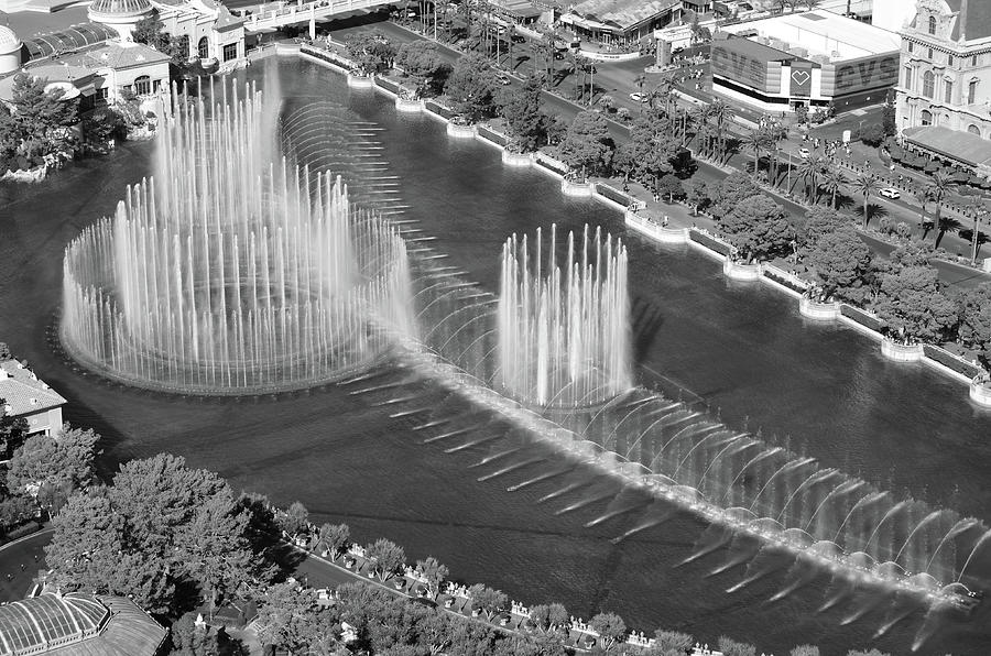Sun Drenched Bellagio Fountain Show on Las Vegas Boulevard Black and White Photograph by Shawn OBrien