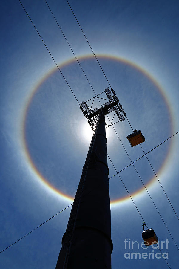 Sun halo and cable car pylon La Paz Bolivia Photograph by James Brunker