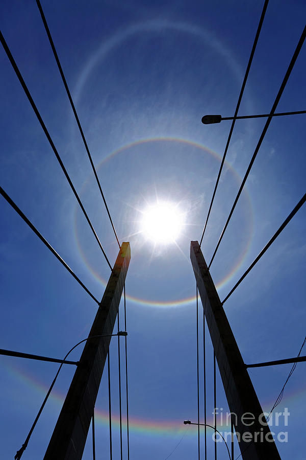 Sun halos above Bridge of the Americas La Paz Bolivia Photograph by James Brunker