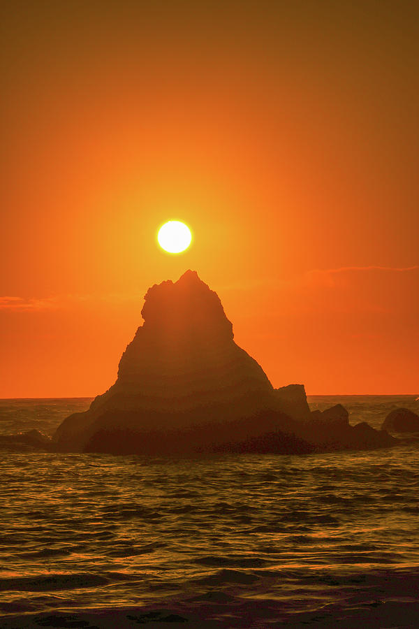 Sun Over A Haystack Rock Photograph