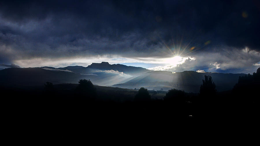 Sun peaking through storm Photograph by Frank Slack