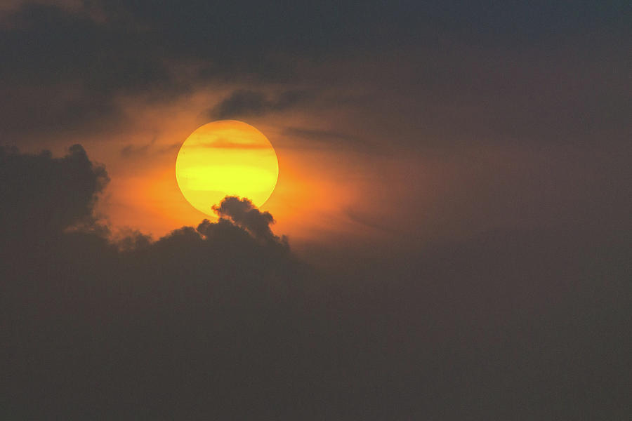 Sun popping into clouds Photograph by Andrew Lalchan