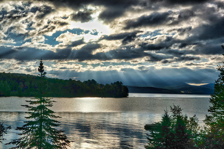 Sun Rays and Storm Clouds Over Rangeley Maine Photograph by Russel Considine