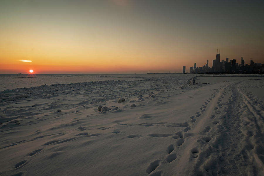 Sun rise on snowy Lake Michigan Photograph by Sven Brogren