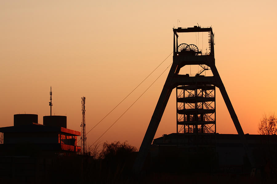 Sun set view of a gold mine in Johannesburg , South Africa Photograph by Bucky_za