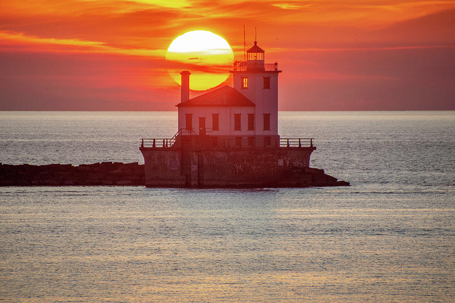 Sun setting behind the lighthouse Photograph by Wayne Kirby - Fine Art ...