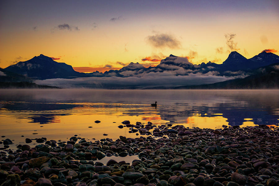 Sun Setting over a Misty Mountain Lake Photograph by Home Now and Then