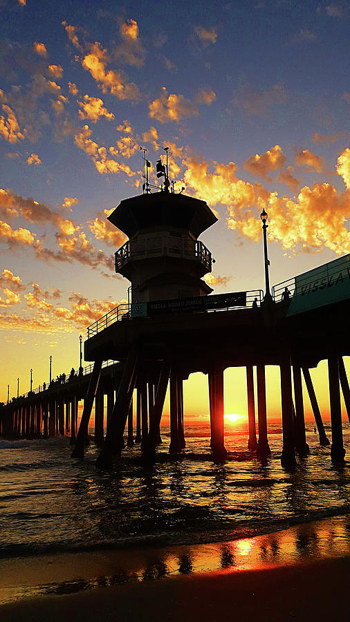 Huntington Beach Photograph - Sun Setting Through The Pier by Ron Regalado