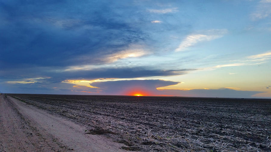 Sun Setting Under a Distant Super Cell  Photograph by Ally White