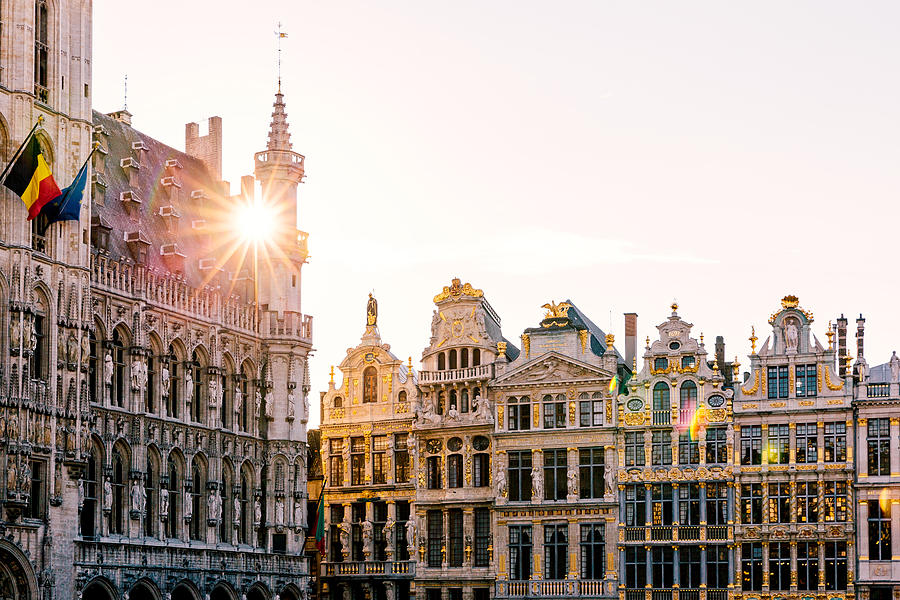 Sun shining through historic buildings at Grand Place in Brussels, Belgium Photograph by Alexander Spatari