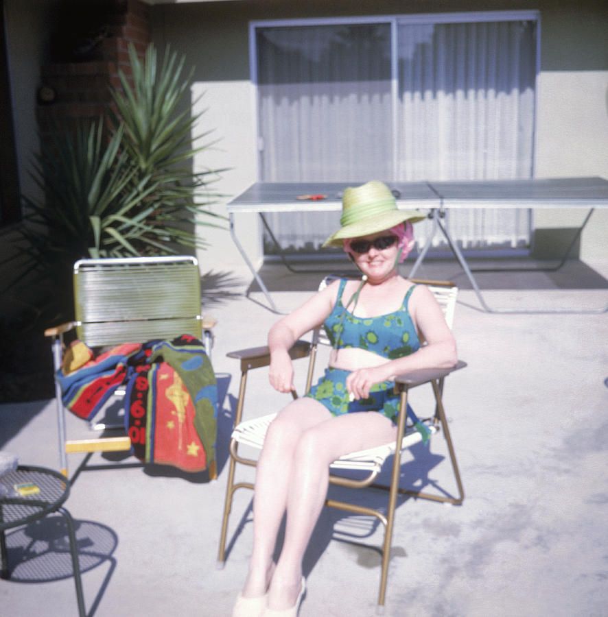 Sunbather relaxing in chair Photograph by Fuse
