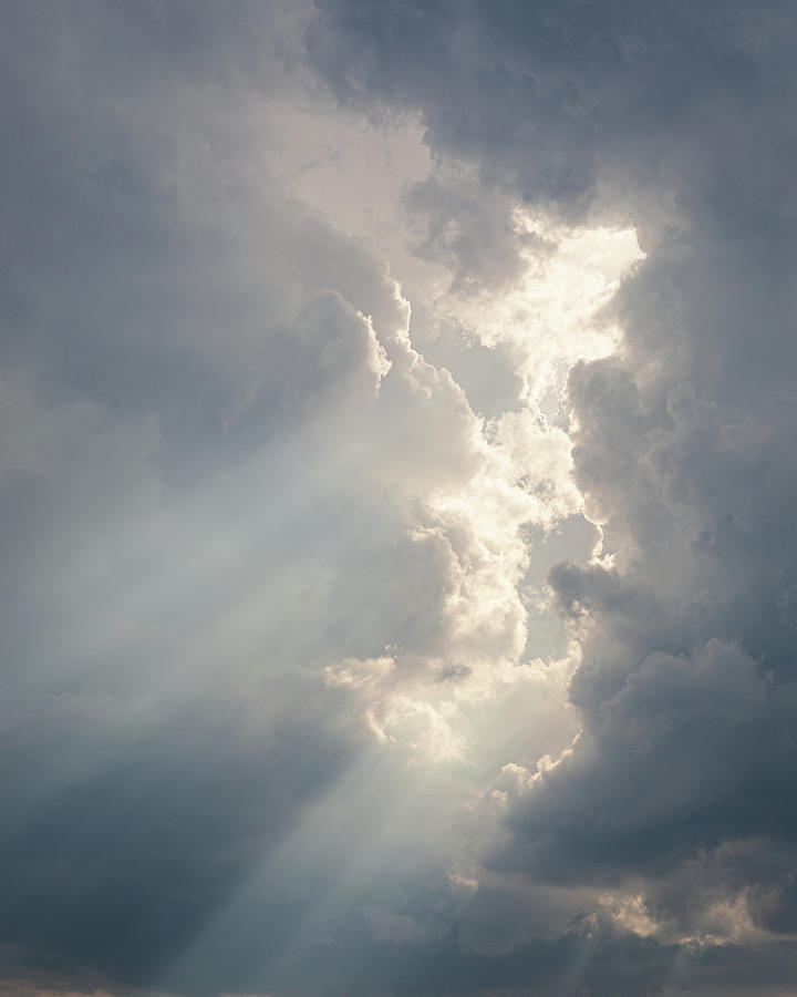 Abstract Photograph - Sunbeam between storm clouds cloudscape sky by Juhani Viitanen