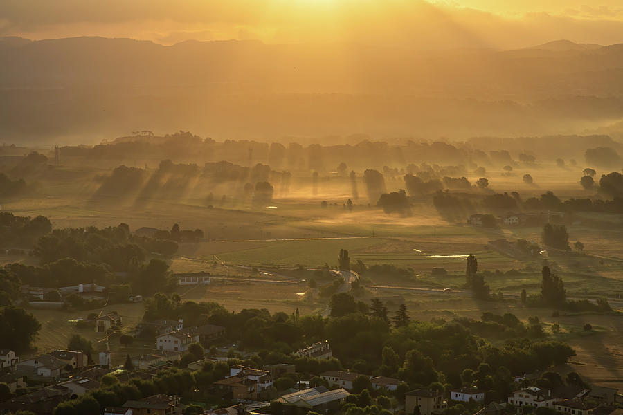 Sunbeams and haze in the valley Photograph by Jordi Carrio Jamila
