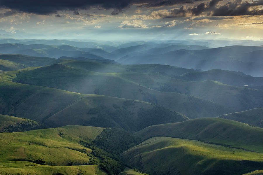 Sunbeams on hills in Caucasus mountains Photograph by Mikhail Kokhanchikov