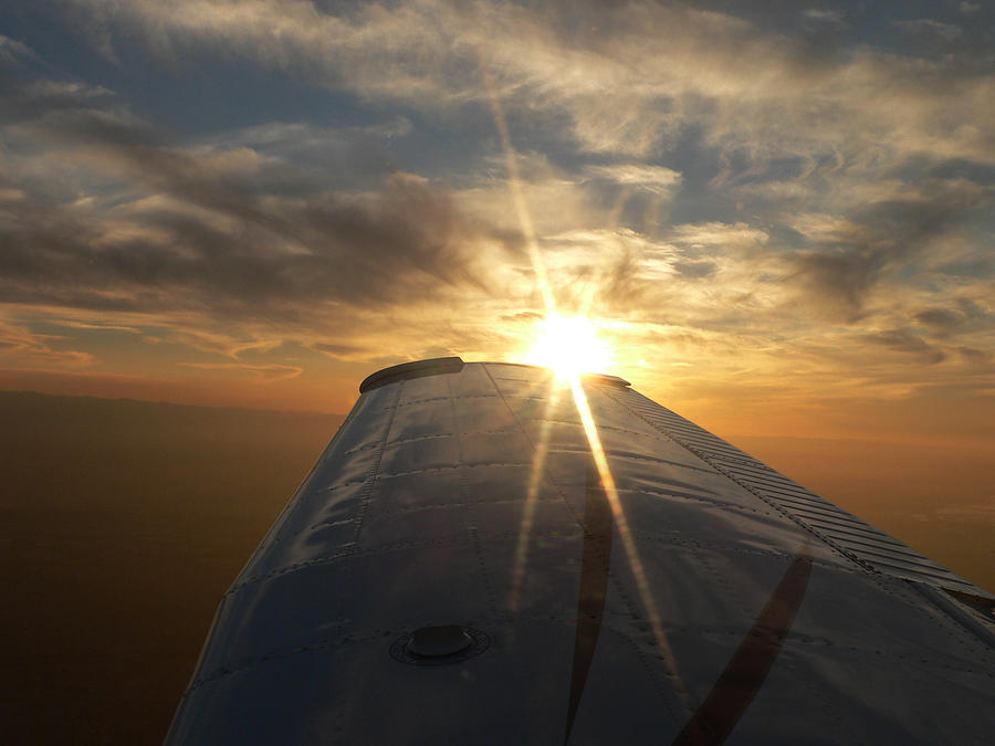 Sunburst on Plane Wing Photograph by Beverly Read
