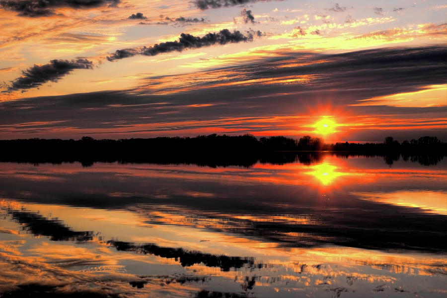 Sunburst Over South Rice Lake Photograph by Dale Kauzlaric