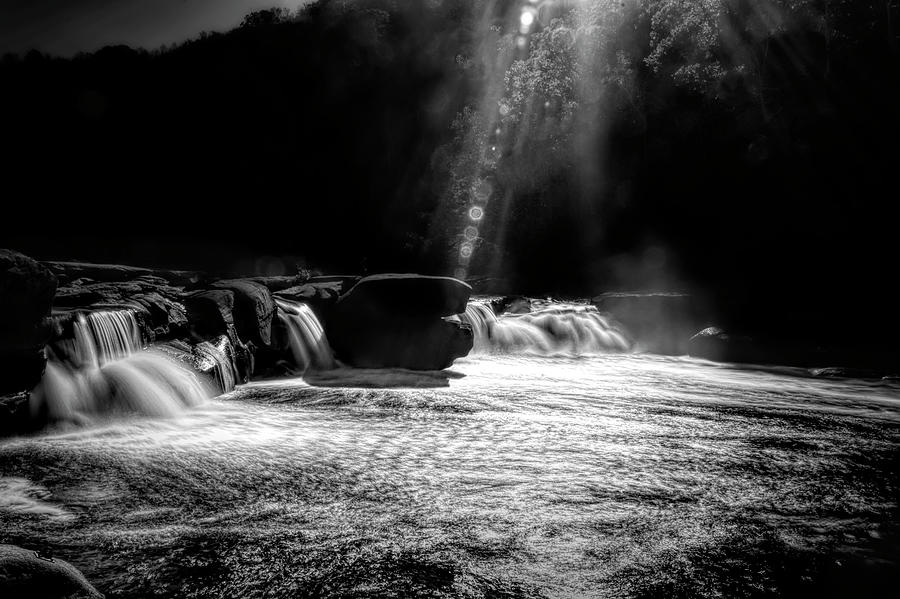 Sunburst over the waterfall Photograph by Dan Friend