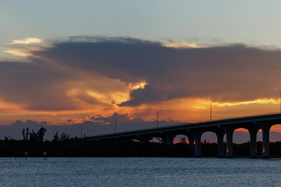 Sundown over bridge Photograph by Les Greenwood