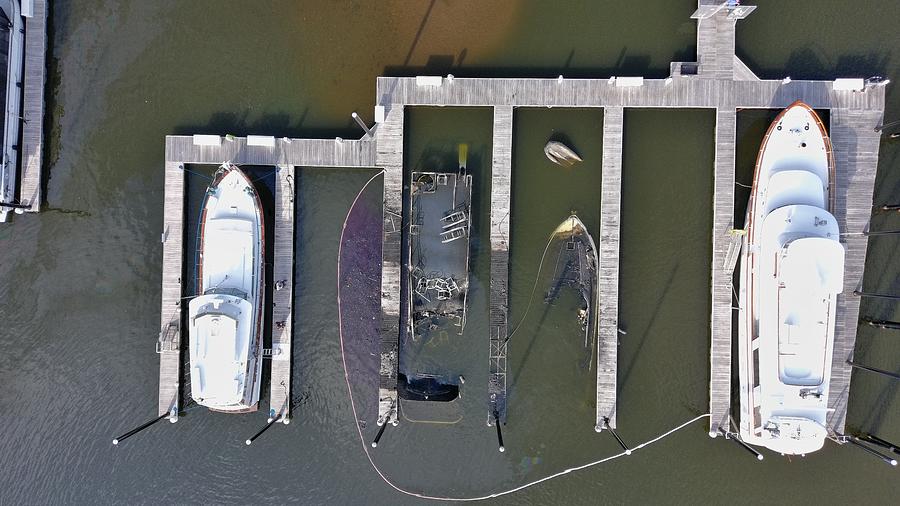Sunken boats after marina fire Photograph by Greg Schulz Pictures Over Stillwater