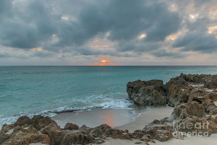 Sunrise and Clouds on Horizon Photograph by Tom Claud