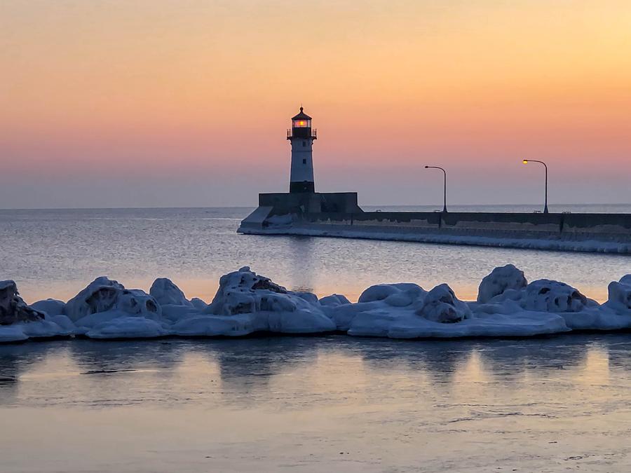 Sunrise at North Pier Lighthouse Photograph by Susan Rydberg