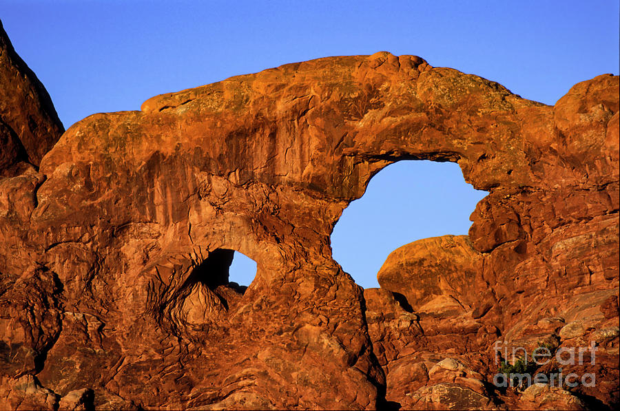 Sunrise at Turret Arch in Arches National Park Photograph by Bob Phillips