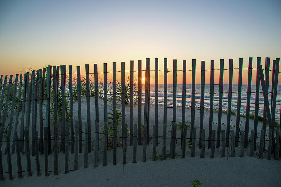 Sunrise behind the Beach Fence Photograph by Matthew DeGrushe
