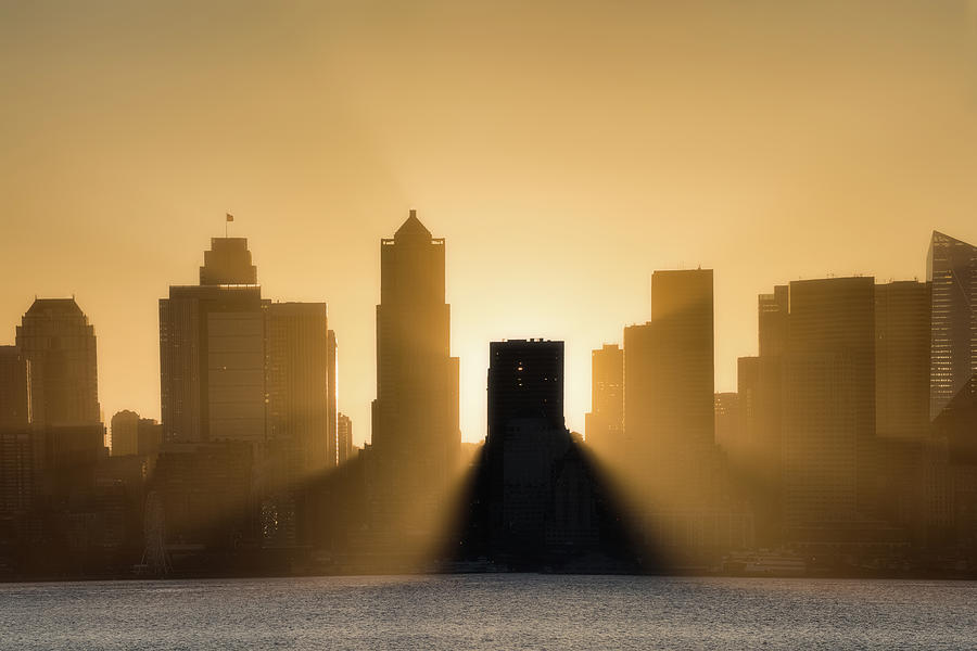 Sunrise crashing in on downtown Seattle Photograph by Murray Rudd