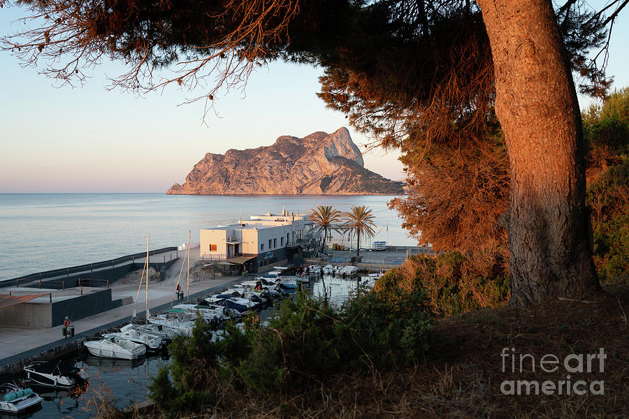 Sunrise in the Les Bassetes cove in Calpe Photograph by Adriana Mueller