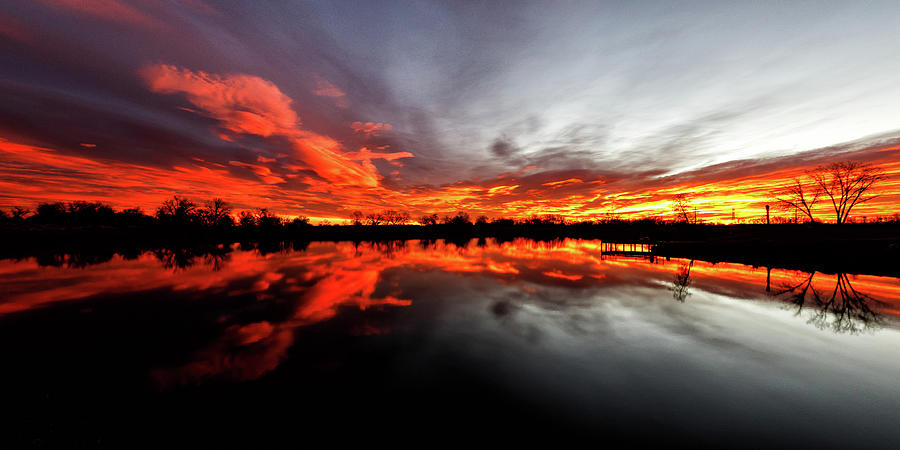 Sunrise Of Orange And Red Reflected On A Pond Photograph