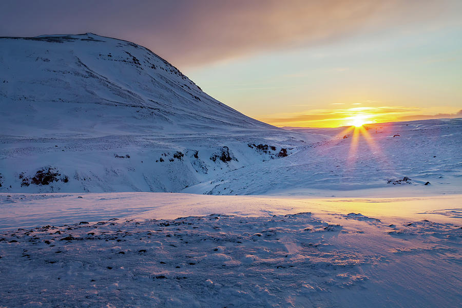 Sunrise over ice and snow in South Iceland. Photograph by Victoria Ashman