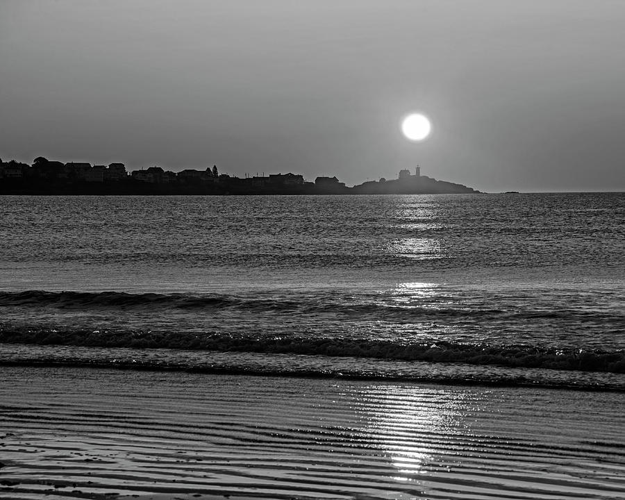 Sunrise over the Nubble Lighthouse from Long Sands Beach Long Beach York Maine Black and White Photograph by Toby McGuire