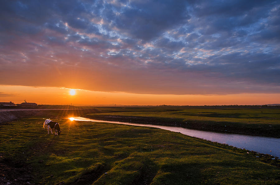 Sunrise over winding river in grassland, northern China Photograph by Haitong Yu