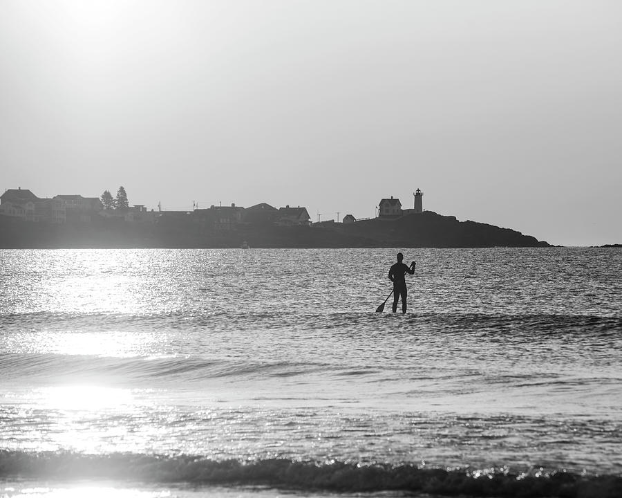 Sunrise Paddle Boarder by the Nubble Lighthouse from Long Sands Beach Long Beach York Maine BW Photograph by Toby McGuire