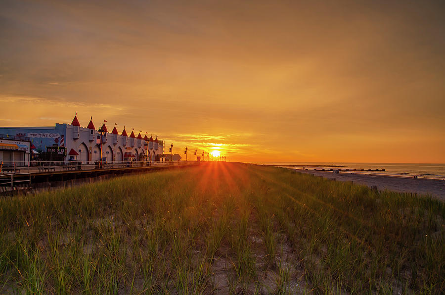 Sunrise - The Boardwalk and Beach at Ocean City New Jersey Photograph by Bill Cannon