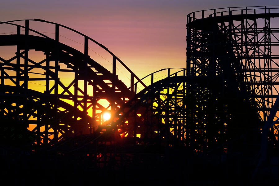 Sunrise Photograph - Sunrise through the rails of the Zippin Pippin Roller Coaster by James Brey