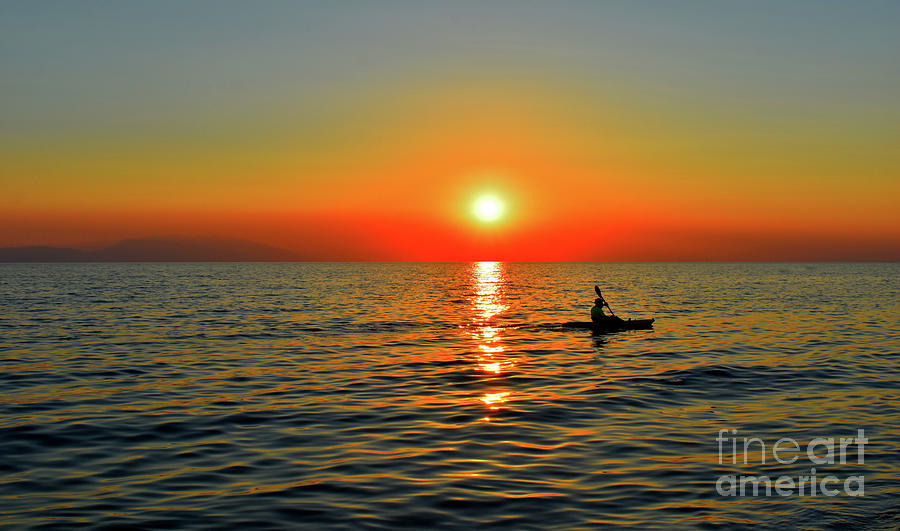 Sunset Above Seascape With Kayaker   Photograph by Leonida Arte