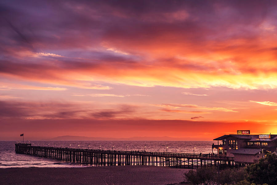 Sunset and Clouds Over the Pier Photograph by Lindsay Thomson