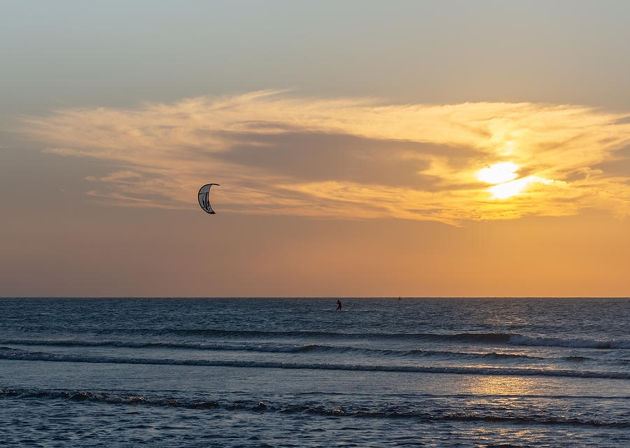 Sunset and kitesurfing practice at Jericoacoara beach. Photograph by Marcia Silva de Mendonca