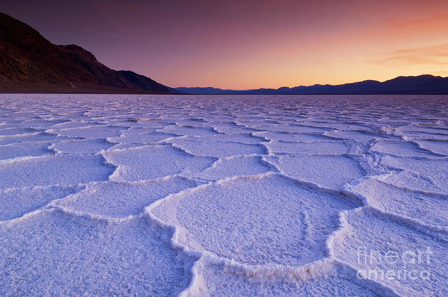 Sunset at Badwater Basin salt pans, Death Valley, California, USA Photograph by Neale And Judith Clark