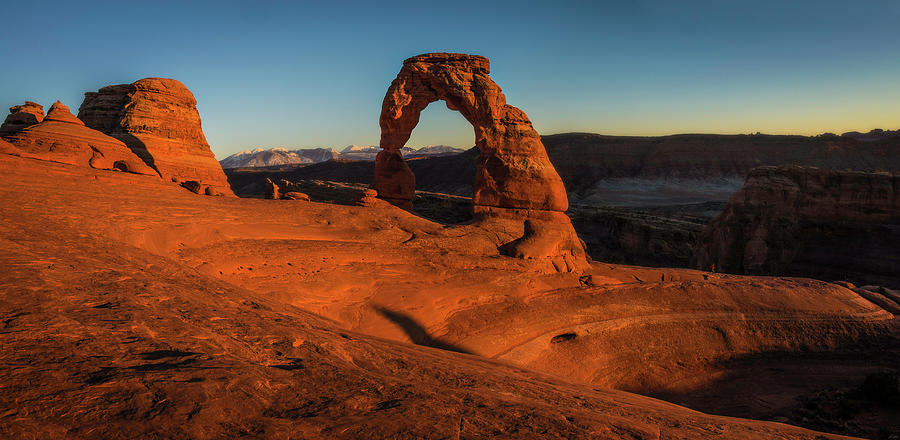Sunset at Delicate Arch Photograph by Owen Weber